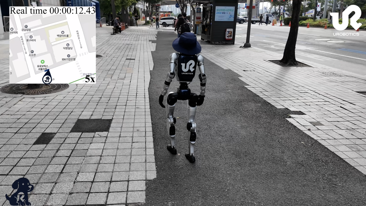 A humanoid robot developed by URobotics walks down the streets near Gangnam Station, southern Seoul. (KAIST)