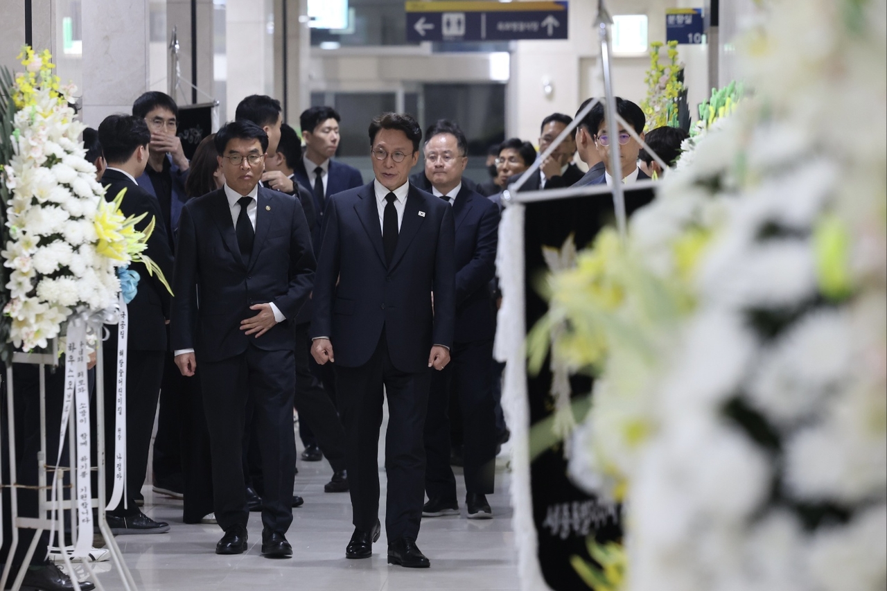 Prime Minister Kim Min-seok (second from left, front) visits a funeral of a deceased civil servant of the Interior Ministry who were handling the government service outage in Sejong on Friday. (Courtesy of the Prime Minister's Office)