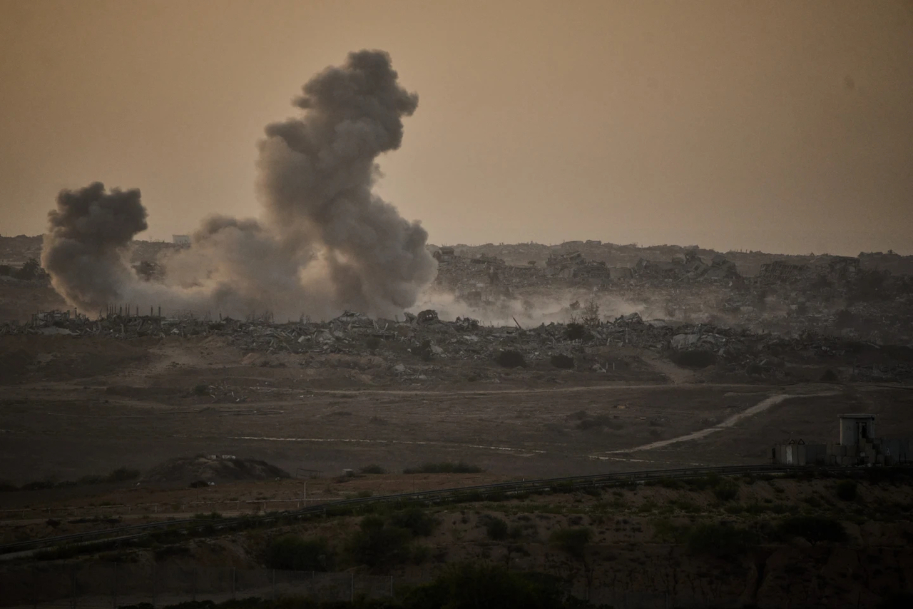 Smoke rises to the sky following an Israeli military strike in the northern Gaza Strip, as seen from southern Israel, Friday. (AP)