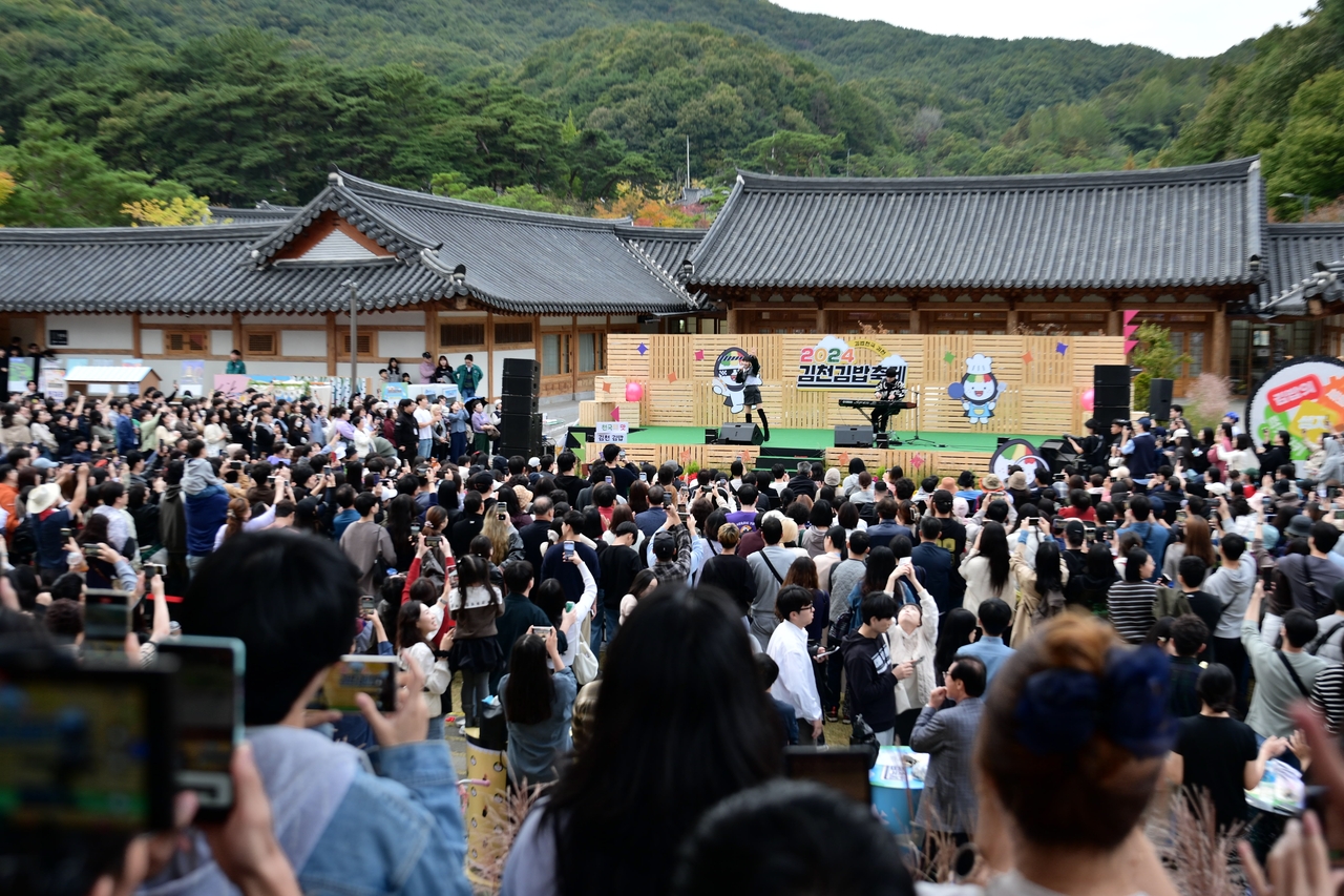 Korean singer Jadu, best known for her early 2000s hit “Gimbap,” draws a massive crowd at the 2024 Gimcheon Gimbap Festival, a fitting lineup in a city known for both plums and playful branding.  "Jadu" means plum in Korean. (Gimcheon)