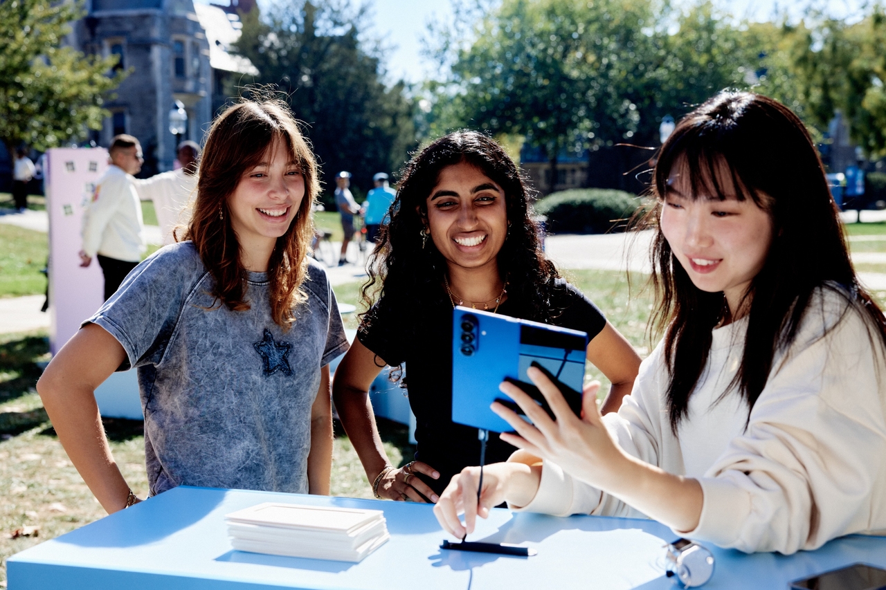 University students participate in the interactive “Hangeul Truck” experience using the Galaxy Z Fold 7, sending messages to their future selves that are instantly translated into Korean through Galaxy AI and shown on a large screen at Princeton University in Princeton, New Jersey. (Samsung Electronics)