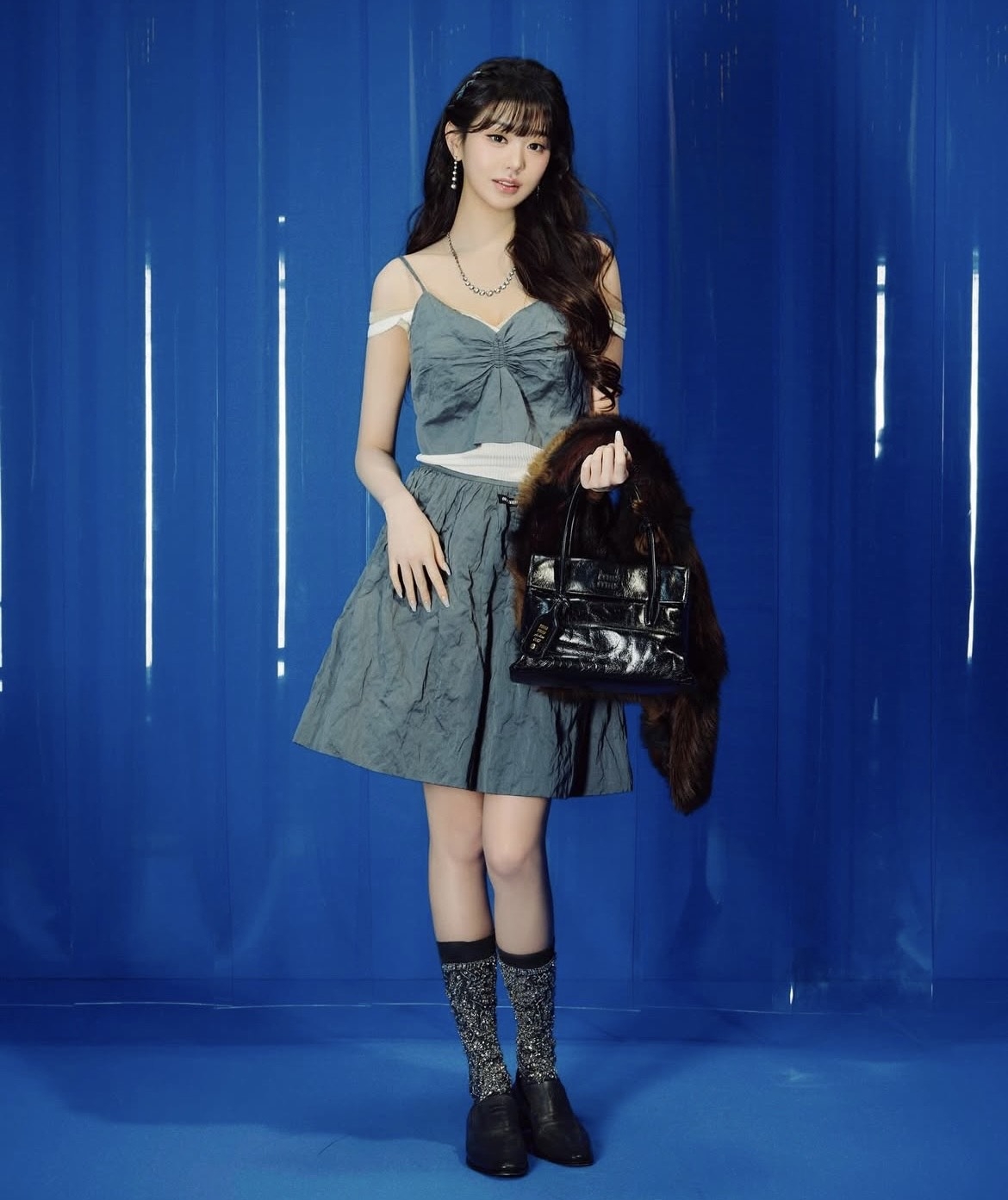 Ive's Wonyoung during Miu Miu's spring-summer 2026 fashion show by Miuccia Prada (Miu Miu's Instagram)