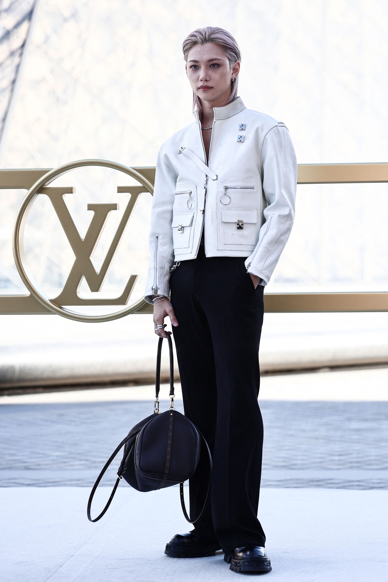 Stray Kids' Felix poses during a photocall ahead of the presentation of creations by Louis Vuitton for the Women Ready-to-wear spring-summer 2026 collection as part of the Paris Fashion Week, in Paris on Sept. 30. (AFP-Yonhap)