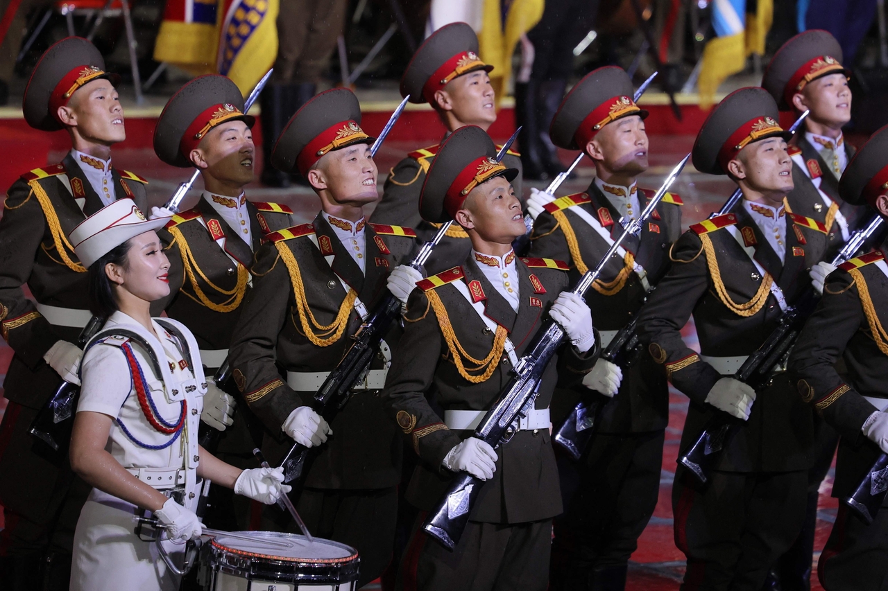 In this pool photograph distributed by the Russian state agency Sputnik, performers take part in an event marking the 80th anniversary of the founding of the Workers' Party of Korea in Pyongyang on Thursday. (AFP-Yonhap)