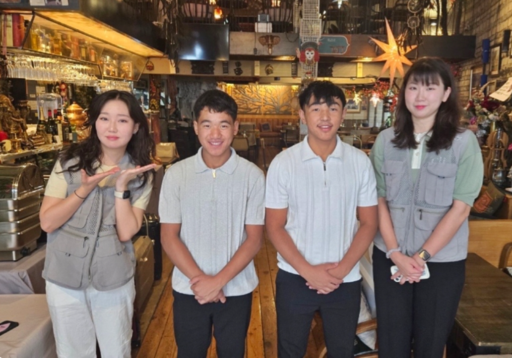 Tamang Nabin (second from left) and his brother Rai Nabin (third from left) pose for a picture with WorldShare officials during their visit to Seoul in August. (WorldShare)