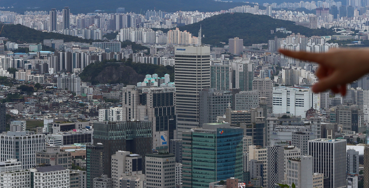 Apartment buildings and office towers are seen from Namsan in central Seoul . (Newsis)