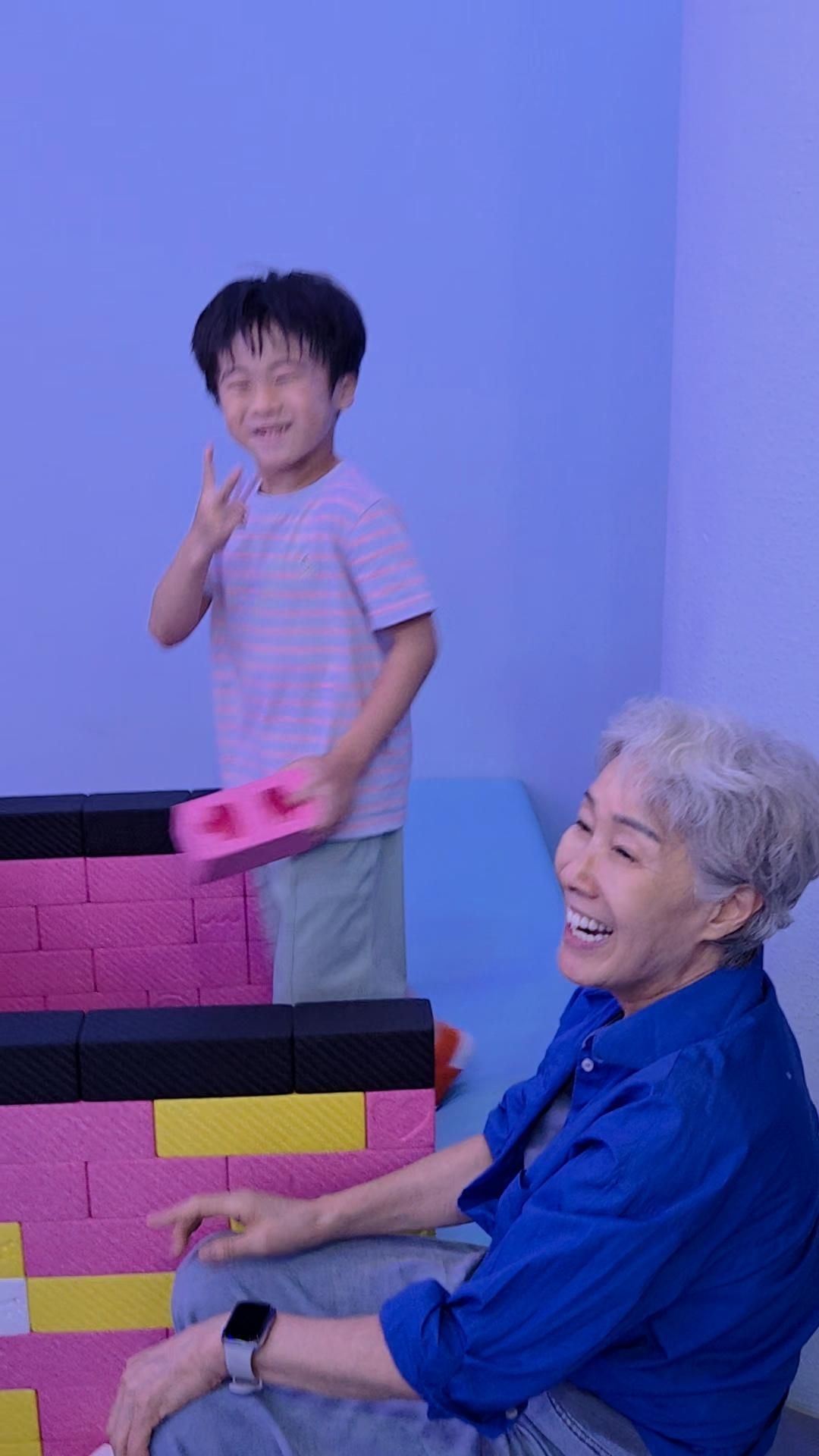 Koo Jung-soo, 66, plays with her 6-year-old grandson at WonderPark, a media art attraction at Seoul Grand Park in Gwacheon, Gyeonggi Province, on June 25. (Koo Jung-soo)