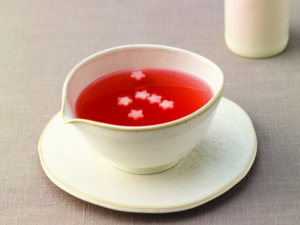 A bright magenta bowl of Korean omija hwachae punch made from dried omija schisandra chinensis berries the foundation ingredient for traditional omija tea