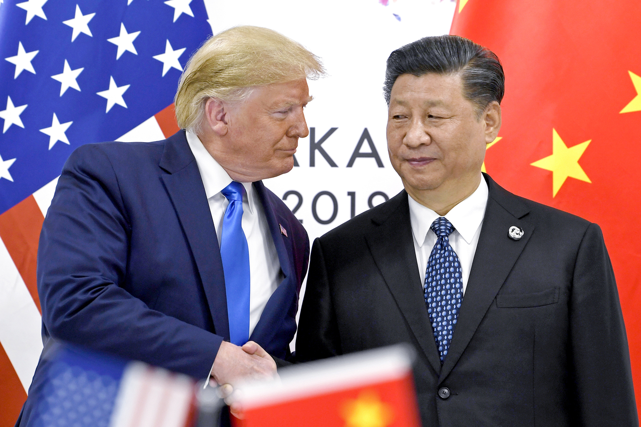 President Donald Trump, left, shakes hands with China's President Xi Jinping during a meeting on the sidelines of the G-20 summit in Osaka, Japan, in June 2019. (AP)