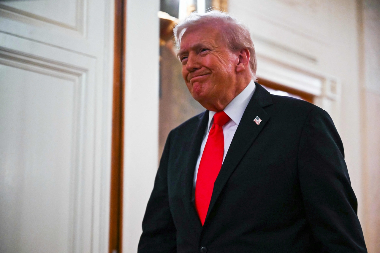 US President Donald Trump walks toward the East Room of the White House for a ballroom dinner in Washington on Wednesday. (AFP-Yonhap)