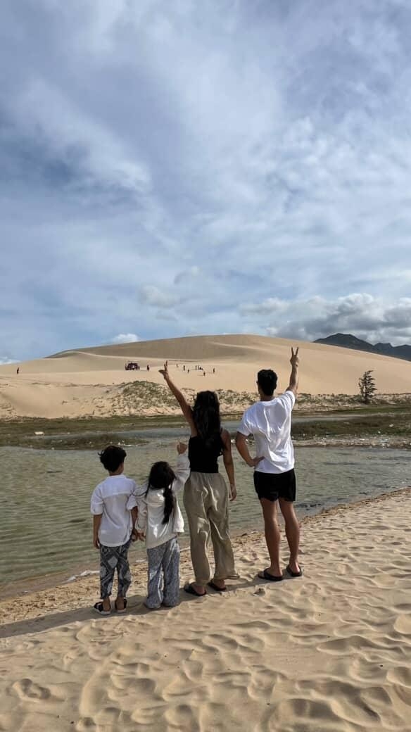 Lee poses for a photo with her husband and two children at a beach. (Courtesy of Lee)