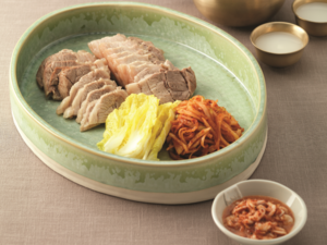 Bossam, braised pork with spicy radish and salt-cured napa cabbage