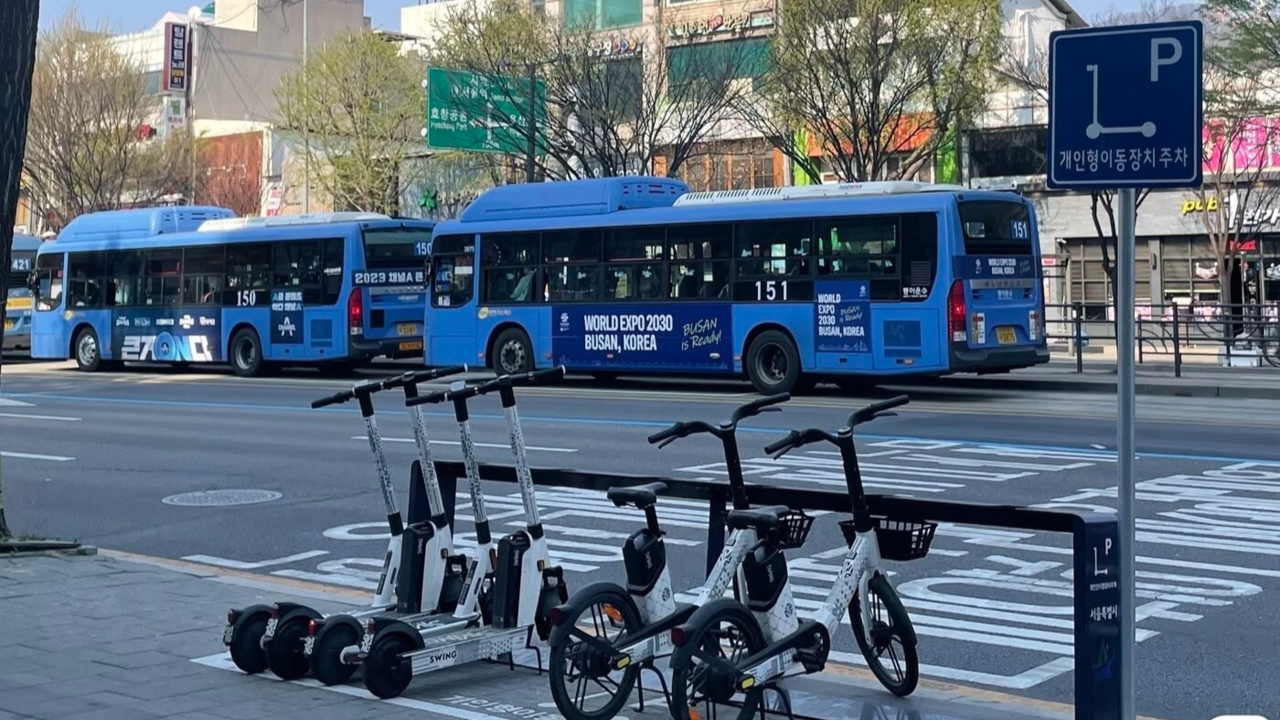 Swing’s shared e-scooters and e-bikes are parked in a Seoul-designated personal mobility zone in Yongsan-gu in 2023. As part of a joint effort to encourage proper parking, Swing offered a 50 percent discount to users who returned devices to official zones. (The Swing)