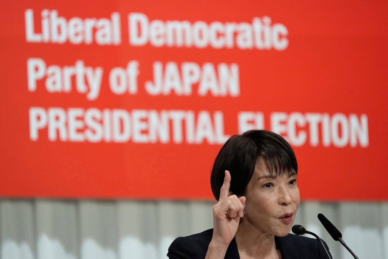 Japan's former Economic Security Minister Sanae Takaichi answers questions during a joint press conference by the Liberal Democratic Party presidential election candidates at the party's headquarters, Sept. 23, 2025, in Tokyo. (Pool Photo via AP)