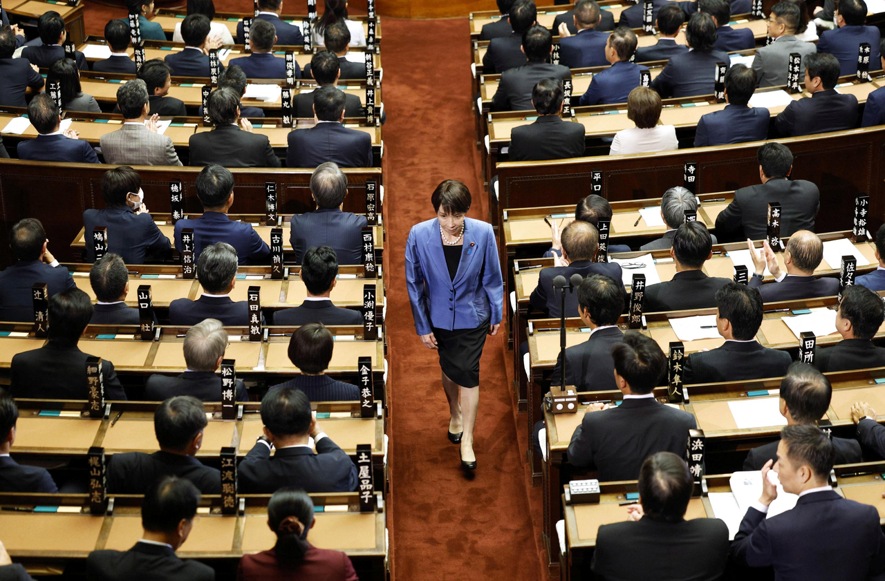 Sanae Takaichi, leader of the ruling Liberal Democratic Party, walks after casting a vote in an election to choose Japan's next prime minister at the Lower House of Parliament in Tokyo, Japan, on Tuesday.  (Kyodo via Reuters)