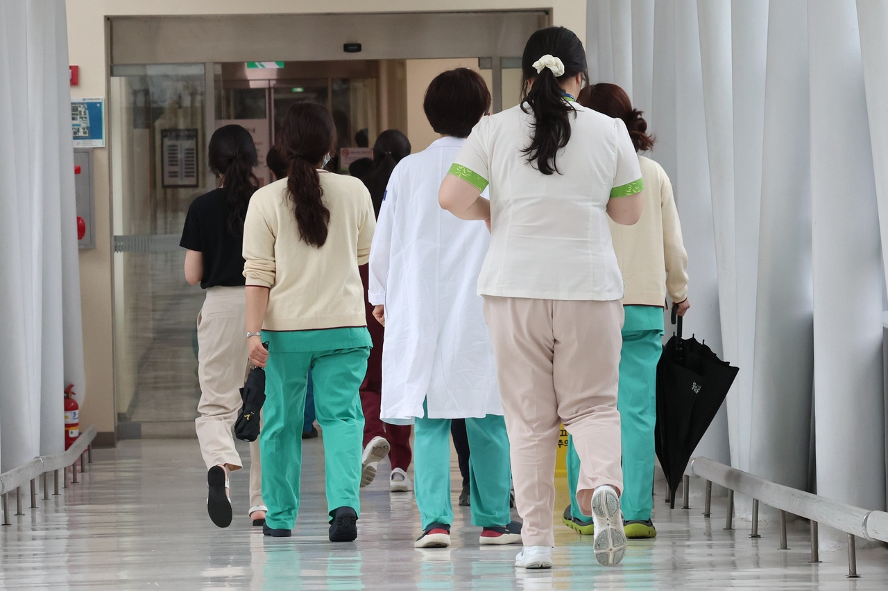 Nurses are seen walking inside a university hospital in Seoul on June 20, shortly before the Nursing Act was enforced. The law, newly created after 19 years of failed attempts, provides an independent legal framework for the nursing profession in South Korea. (Newsis)