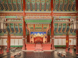 Previous first lady sitting on throne at royal palace sparks yet another controversy