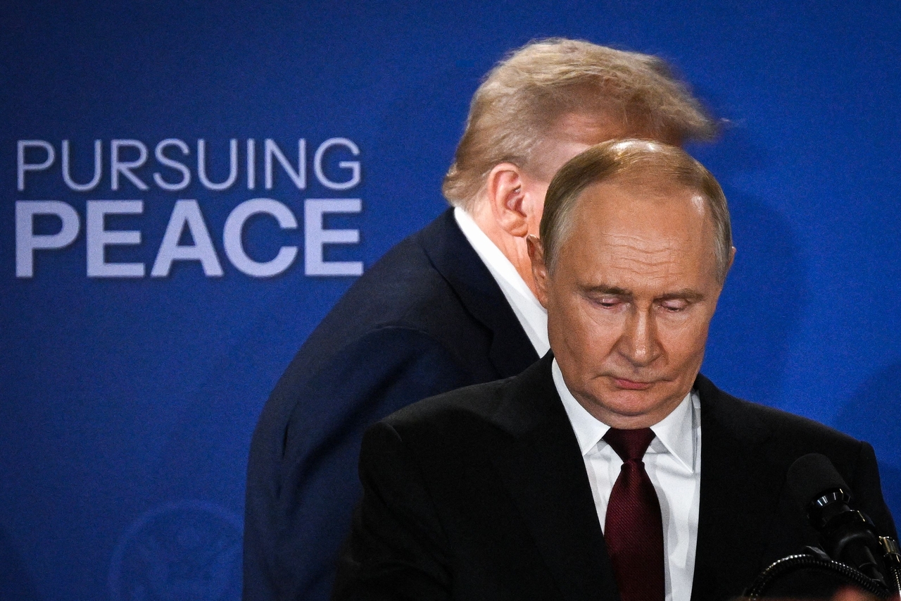 US President Donald Trump (back) and Russian President Vladimir Putin arrive to deliver a joint press conference after participating in a US-Russia summit on Ukraine at Joint Base Elmendorf-Richardson in Anchorage, Alaska, on Aug. 15.   AFP-Yonahp