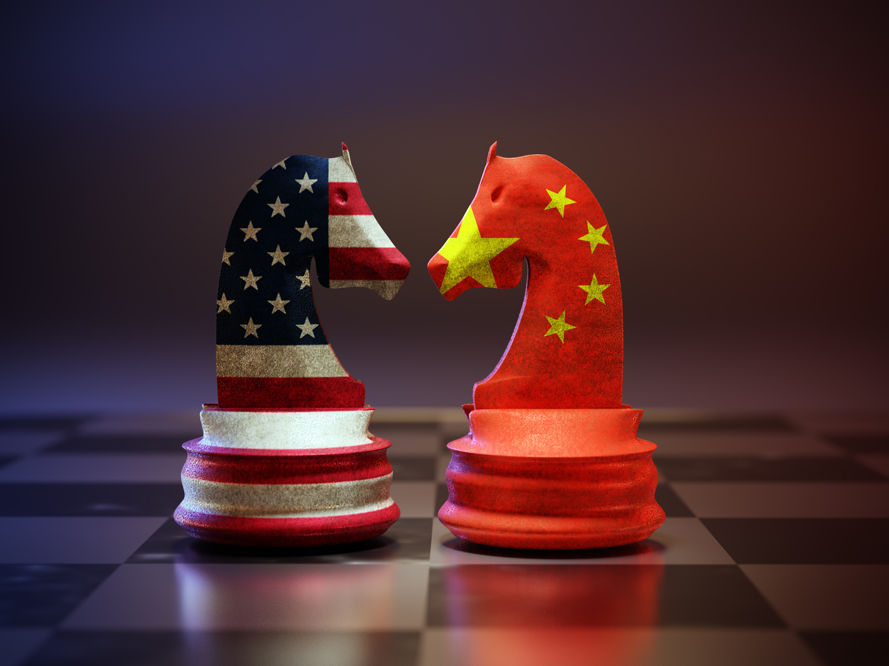 Two chess knights with American and Chinese  flags superimposed standing face to face on chessboard. (123RF)