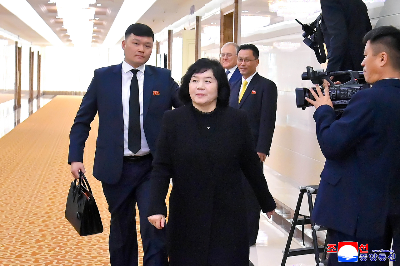 North Korean Foreign Minister Choe Son-hui (second from left) walks out to get on the flight to Russia on Sunday in this Korean Central News Agency file photo.  (Yonhap)