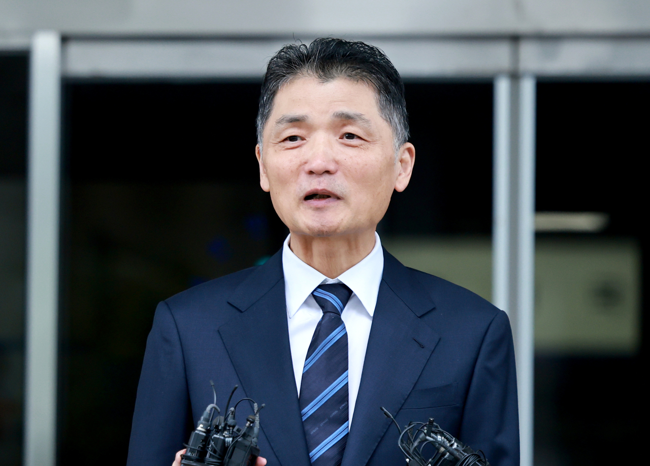 Kim Beom-su, founder of tech giant Kakao Corp., speaks to reporters as he leaves the Seoul Southern District Court in the capital on Oct. 21, 2025, after the court acquitted him of stock manipulation charges. (Yonhap)