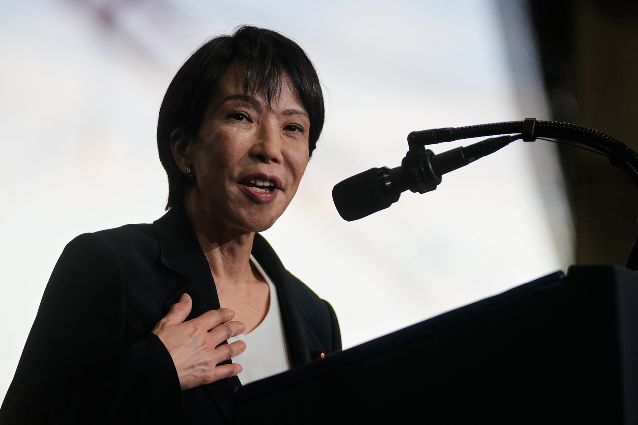 Japanese Prime Minister Sanae Takaichi, with President Donald Trump, speaks to members of the military aboard the USS George Washington, an aircraft carrier docked at a US naval base, in Yokosuka, south of Tokyo, Tuesday, on Tuesday. (AP)