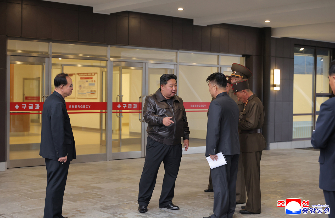 This still taken from from the Korean Central News Agency shows North Korean leader Kim Jong-un (second from left) visiting a new modern hospital, as reported by the KCNA, Friday. (Yonhap)