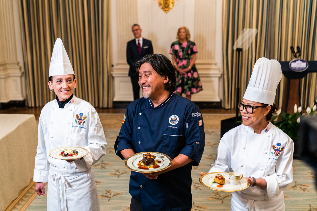 Guest chef Edward Lee (center), White House executive chef Cristeta Comerford (right) and White House executive pastry chef Susie Morrison display dishes at a media preview before a state dinner at the White House in Washington, April 24, 2023. (Getty Images)