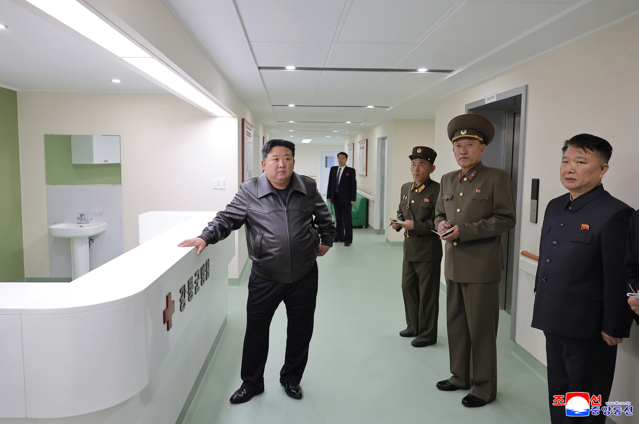 This file photo from the Korean Central News Agency shows North Korean leader Kim Jong-un visiting a new modern hospital. (Yonhap)