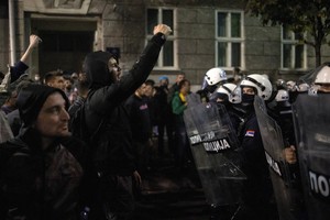 Riot police separate opponents, loyalists of Serbia's president as tensions soar amid protests