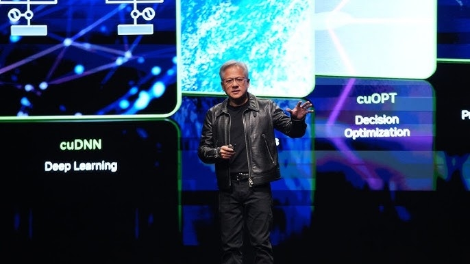 Jensen Huang, CEO of NVIDIA, on stage at the NVIDIA AI Summit India 2024 held on October 24, 2024, at the Jio World Centre in Mumbai. During this keynote, he unveiled the Small Language Model (SLM) ‘Nemotron‑4‑Mini‑Hindi‑4B’, highlighting its efficiency and ability to handle regional languages like Hindi compared to larger language models (LLMs). The background shows NVIDIA branding and the AI Summit stage, emphasizing his statement that “Hindi is one of the most challenging languages for language model development, and India can lead the solution.” [nvidia]