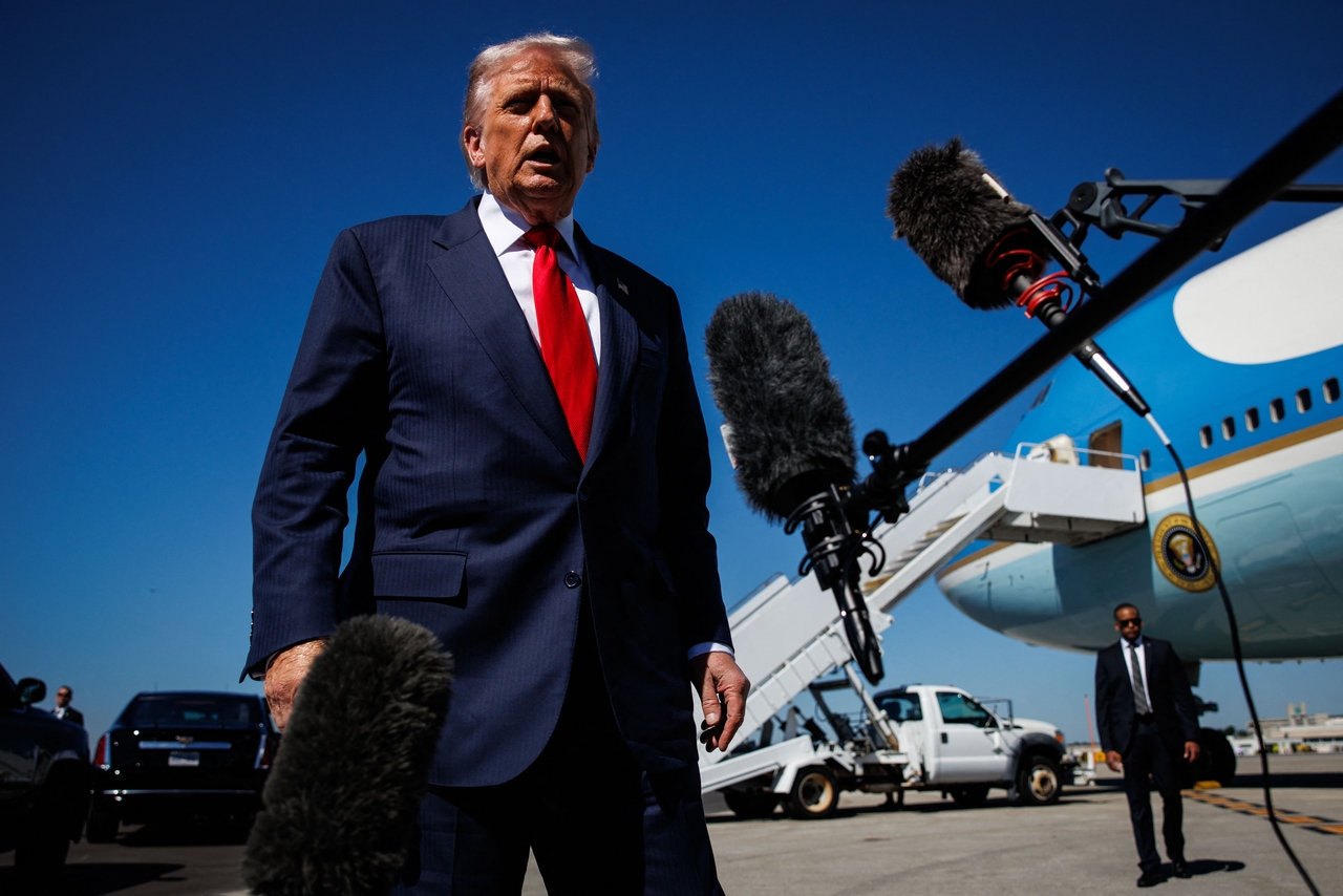 US President Donald Trump speaks to reporters as he arrives at Palm Beach International Airport on Oct. 31 in West Palm Beach, Florida. (Getty Images via AFP)
