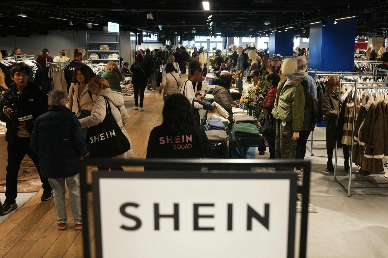 Costumers shop on the opening day of Asian e-commerce giant Shein's first physical store at the Bazar de l'Hotel de Ville department store in Paris on Wednesday.   AFP-Yonhap