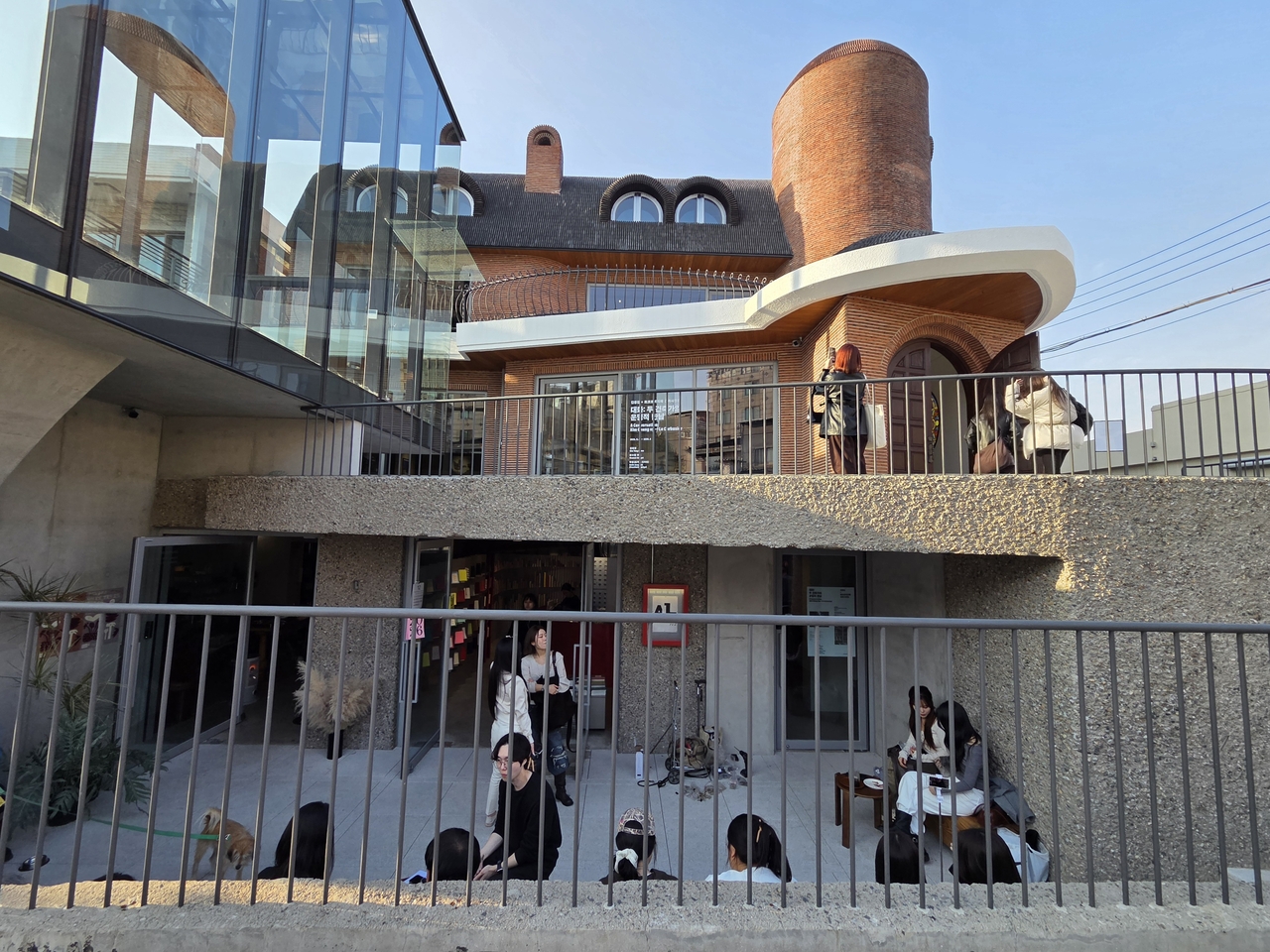 A former residential house designed by Kim Chung-up in Yeonghui-dong, Seoul, is now used as a multipurpose art space with a cafe and shop located in the sunken space, added as the building's function changed over time. (Park Yuna/The Korea Herald)