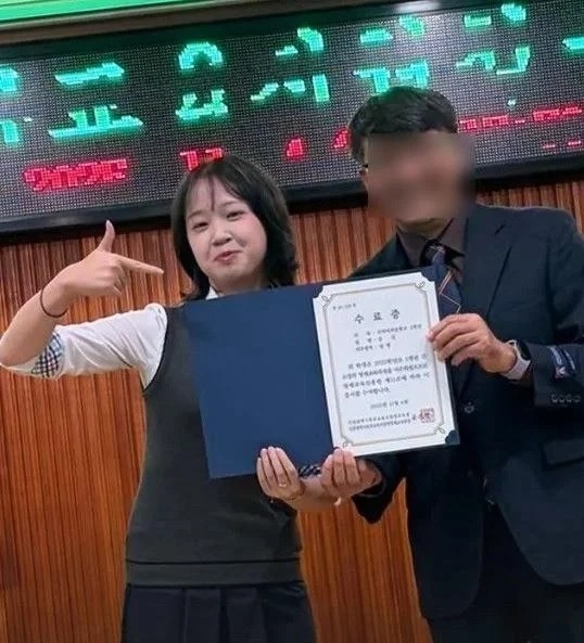 A photo of Kim Seol posing with her certificate at a local gifted education center’s graduation ceremony, posted Monday on her Instagram. (Instagram)