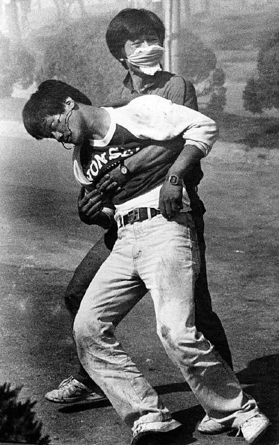 On June 9, 1987, student Lee Han-yeol collapsed after being hit by a tear gas canister during a protest near Yonsei University in Seoul. Captured by Reuters photographer Jung Tae-won, the image became a rallying symbol of South Korea’s pro-democracy movement. (Lee Han Yeol Memorial Museum)