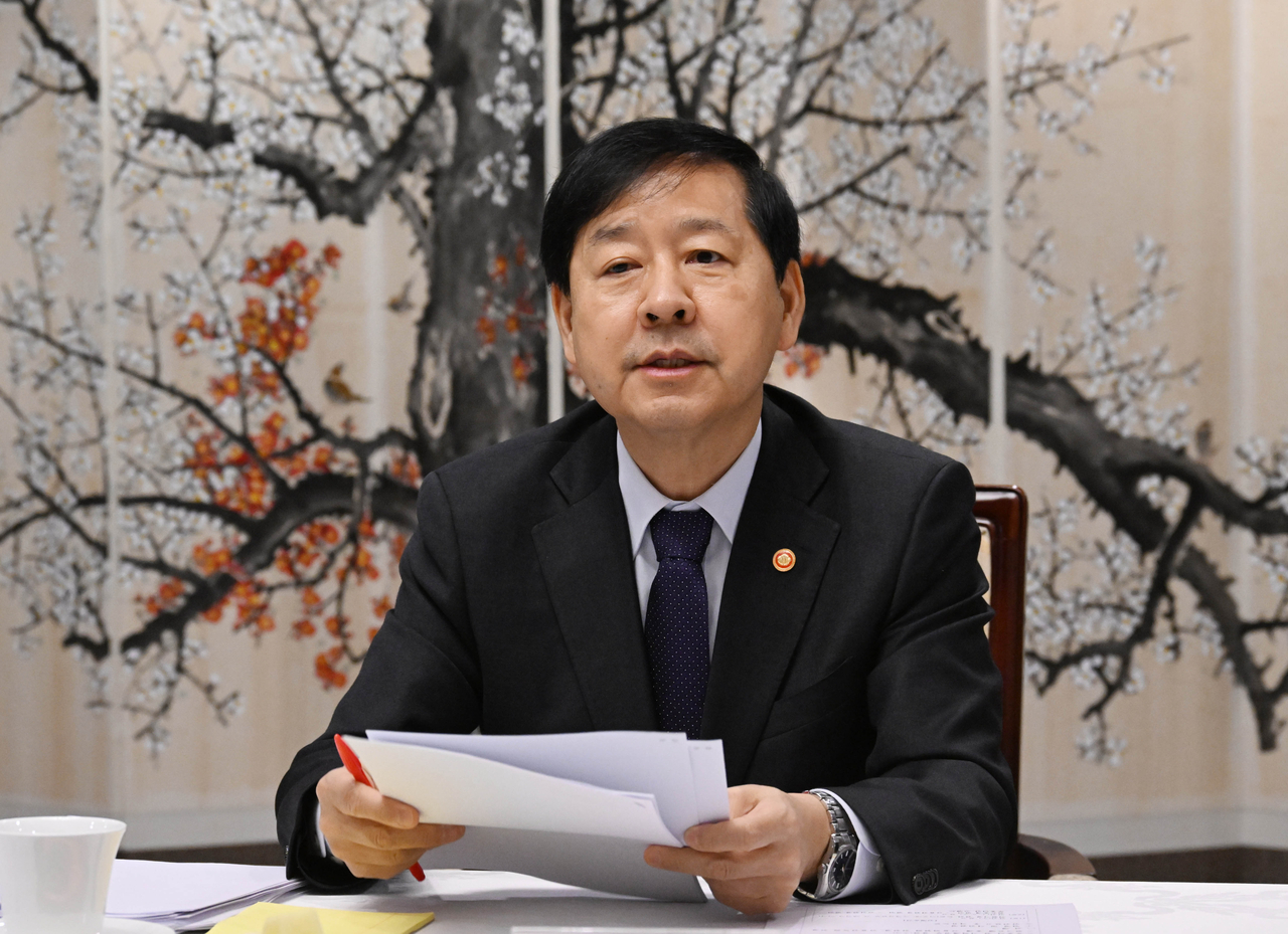 Finance Minister Koo Yoon-cheol presides over a meeting to review market conditions at the Government Complex Seoul in Jongno-gu, Seoul, on Friday. (Yonhap)