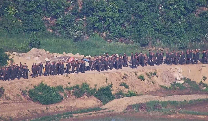 The photo shows large numbers of North Korean soldiers mobilized for border-fortification work inside the DMZ, in this photo provided by South Korea's Joint Chiefs of Staff in June 2024. (Joint Chiefs of Staff)