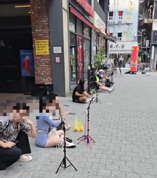 Livestreamers broadcast at Pinocchio Plaza near Bucheon Station. (X)