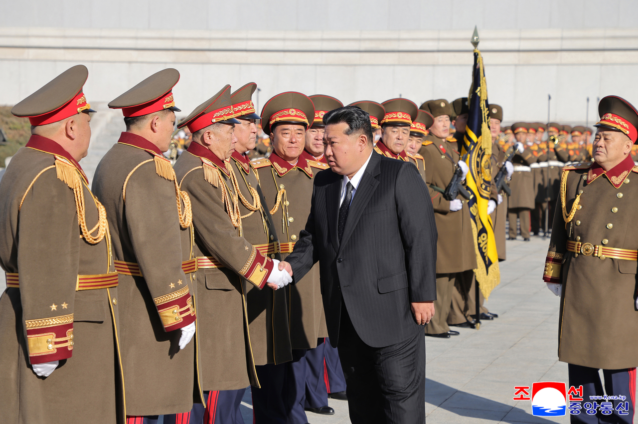 This image shows North Korean leader Kim Jong-un (C) visiting the state security ministry on Tuesday on the occasion of the ministry's 80th founding anniversary. (KCNA via Yonhap)