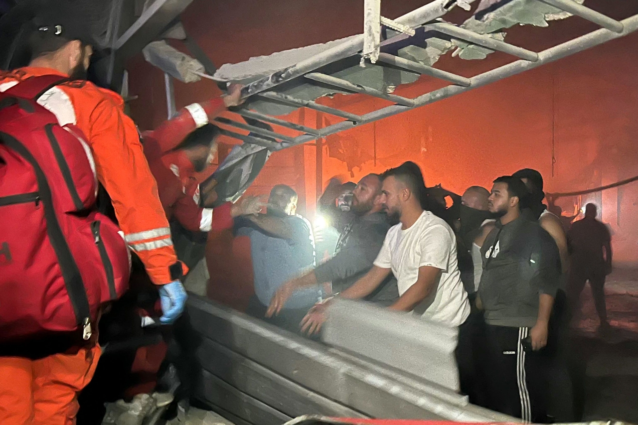 Rescuers search for survivors under rubble at the site of an Israeli drone attack in Sidon, Lebanon, Tuesday. (AFP-Yonhap)