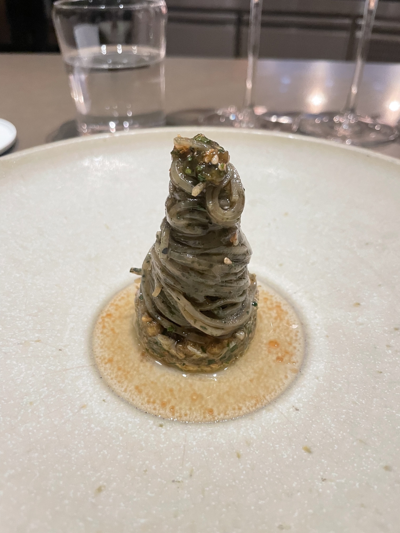 Seroja's betel leaf noodle with ulam dressing and mud crab (Hong Yoo/The Korea Herald)