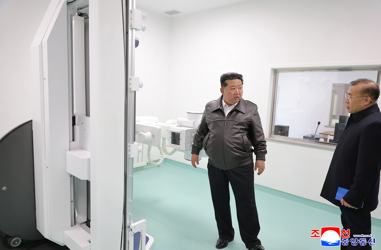 This image shows North Korean leader Kim Jong-un (L) inspecting Kangdong County Hospital on Thursday. (KCNA via Yonhap)