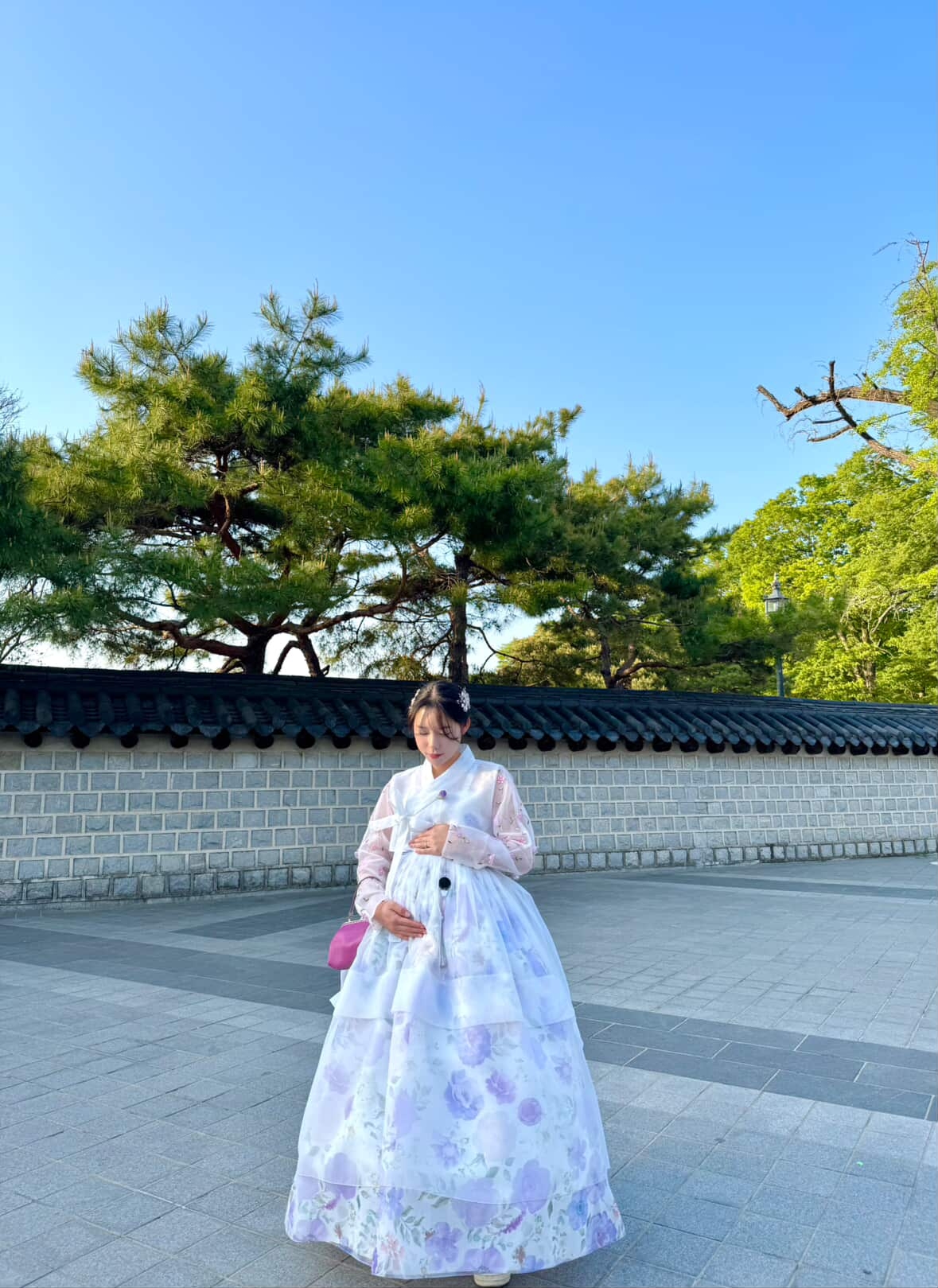 Kim Seo-young, dressed in hanbok, poses for a photo on a street in Jeonju, North Jeolla Province, during her pregnancy. (Courtesy of Kim)