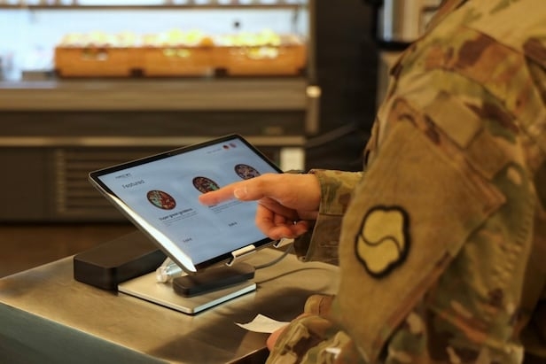 A soldier uses a touchscreen to order a meal at Market 19, an automated dining facility at Camp Walker, home of the 19th Expeditionary Sustainment Command in Nam-gu, Daegu, on Friday. (USFK)