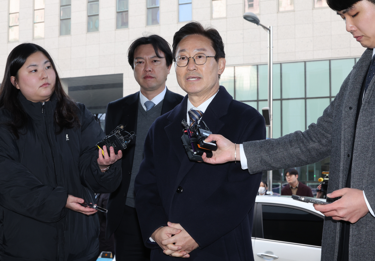 Rep. Park Beom-kye of the Democratic Party of Korea speaks to reporters as he arrives at the Seoul Southern District Court on Friday. (Yonhap)