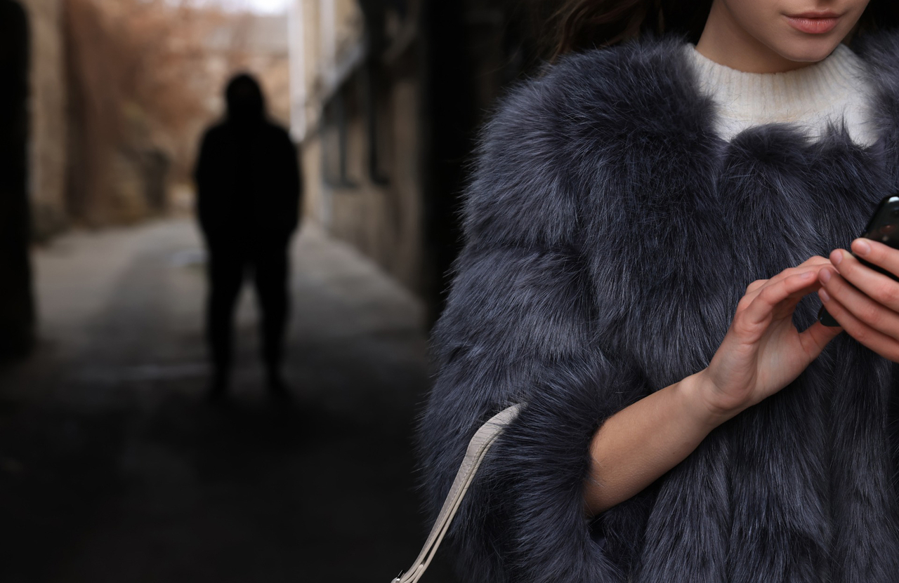 A stock photo of the stalker following the victim. (123rf)