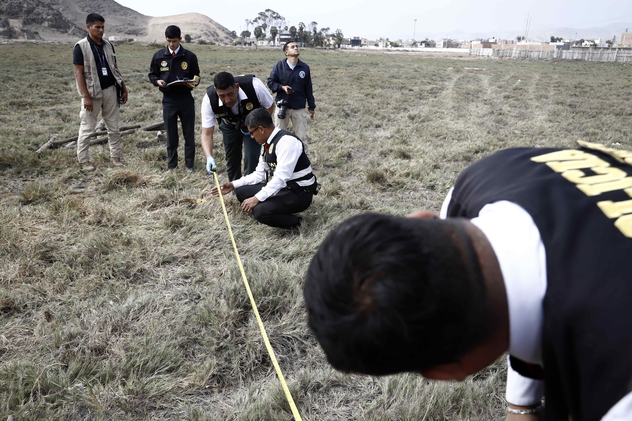Members of the Peruvian National Police work at the site where Rafael Belaunde Llosa (not pictured) was shot at, in Lima, Peru, Tuesday. (EPA-Yonhap)