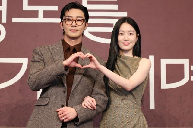 Park Seo-joon, who became a cultural moment as Park Sae-roy in Itaewon Class, photographed at a press event in dark monochrome styling