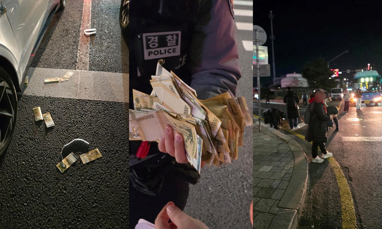 A police officer holds several 50,000 won bills that had scattered on the street. (Instagram @kiki39n)